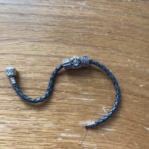 Pandora leather bracelet with three sterling charms